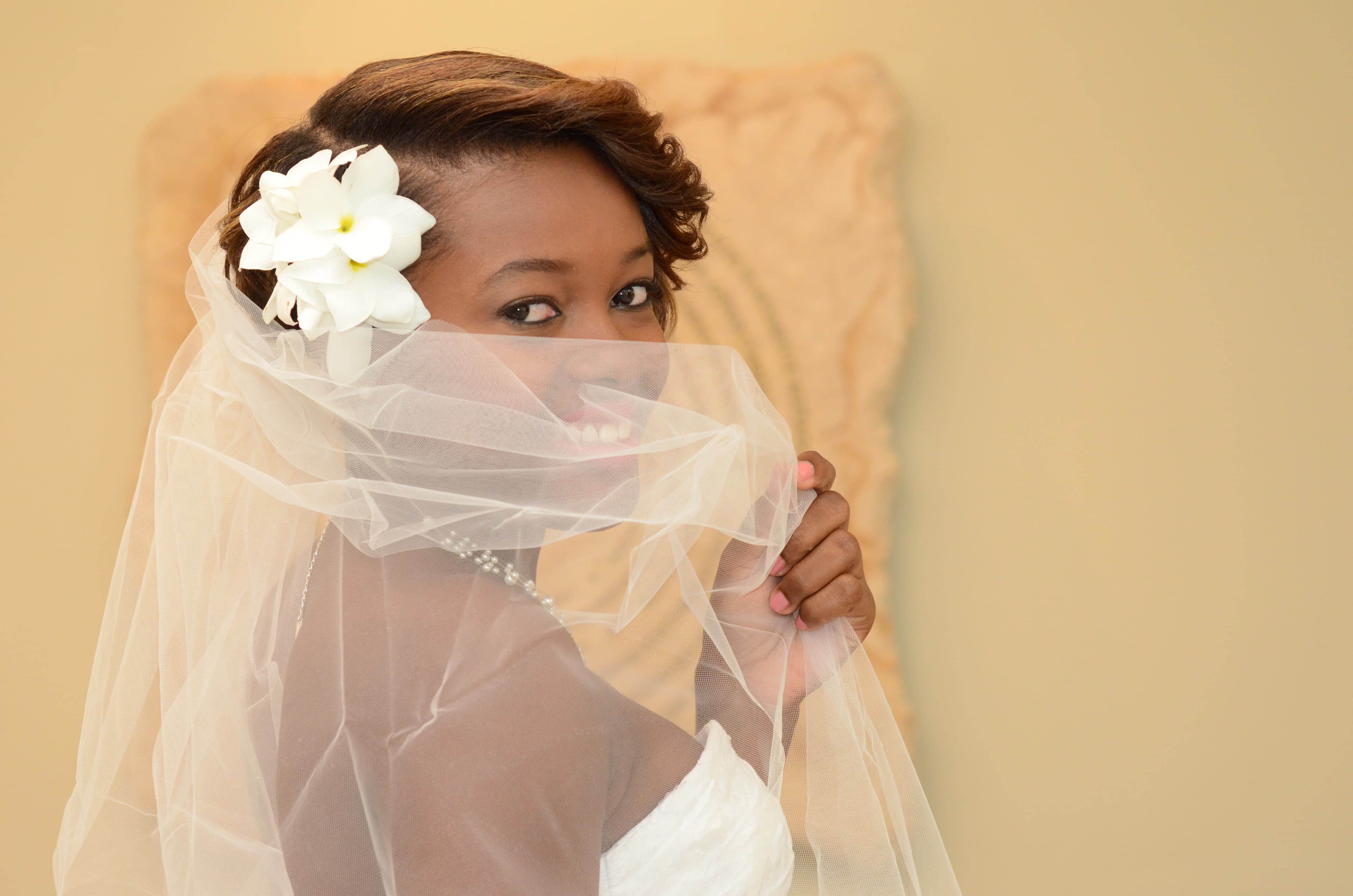 Bride and groom walking through a vineyard at dusk in golden Istrian light