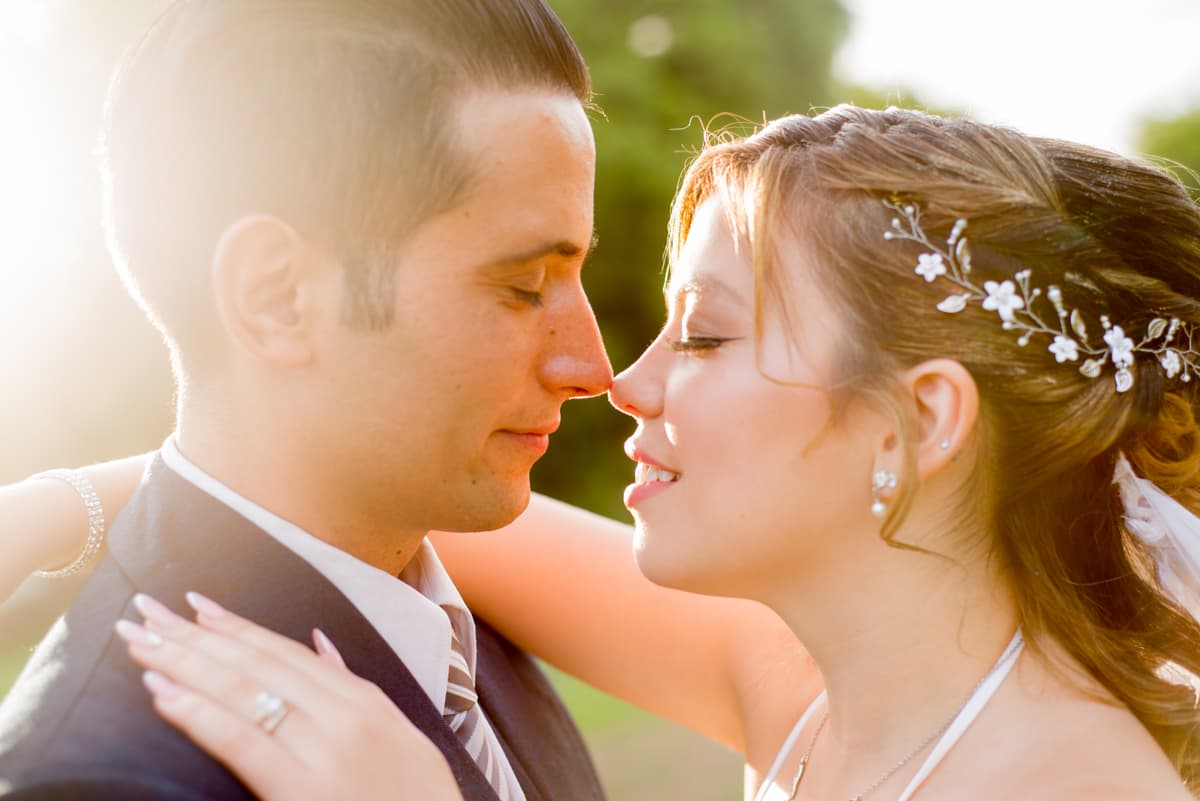 Bride and groom laughing during ceremony in an Istrian olive grove
