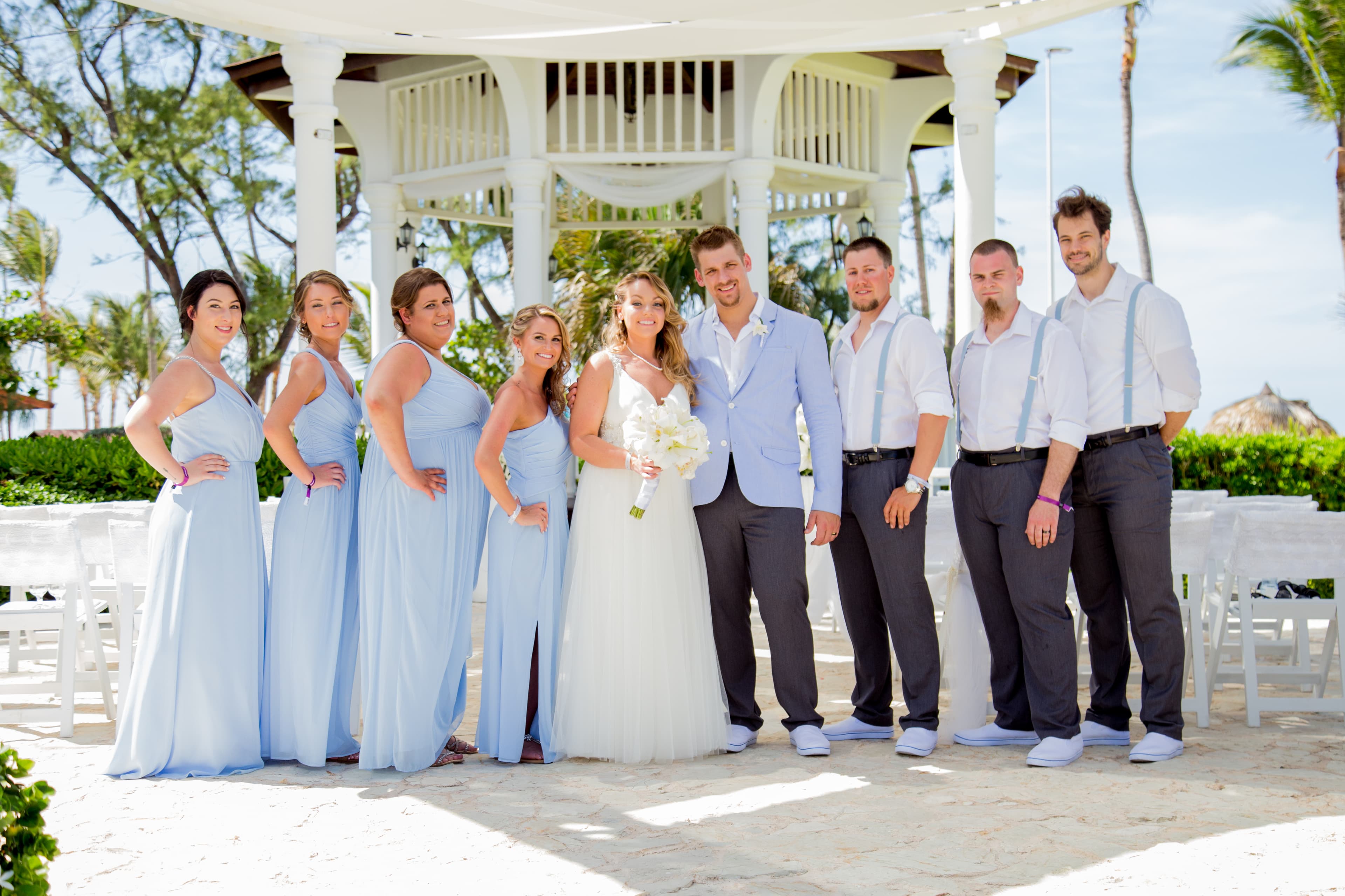 Bride and groom walking through a vineyard at dusk in golden Istrian light