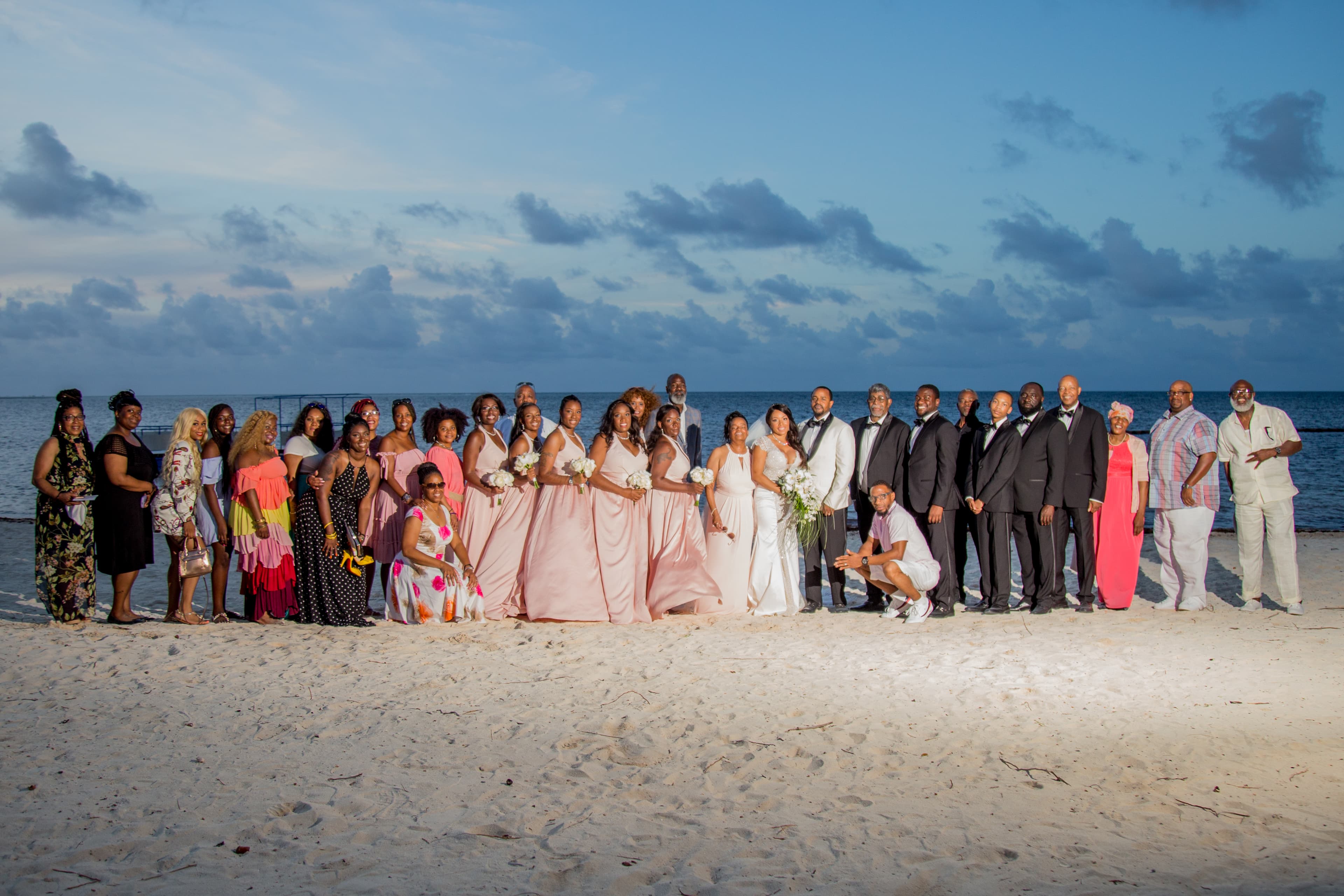 Bride and groom walking through a vineyard at dusk in golden Istrian light