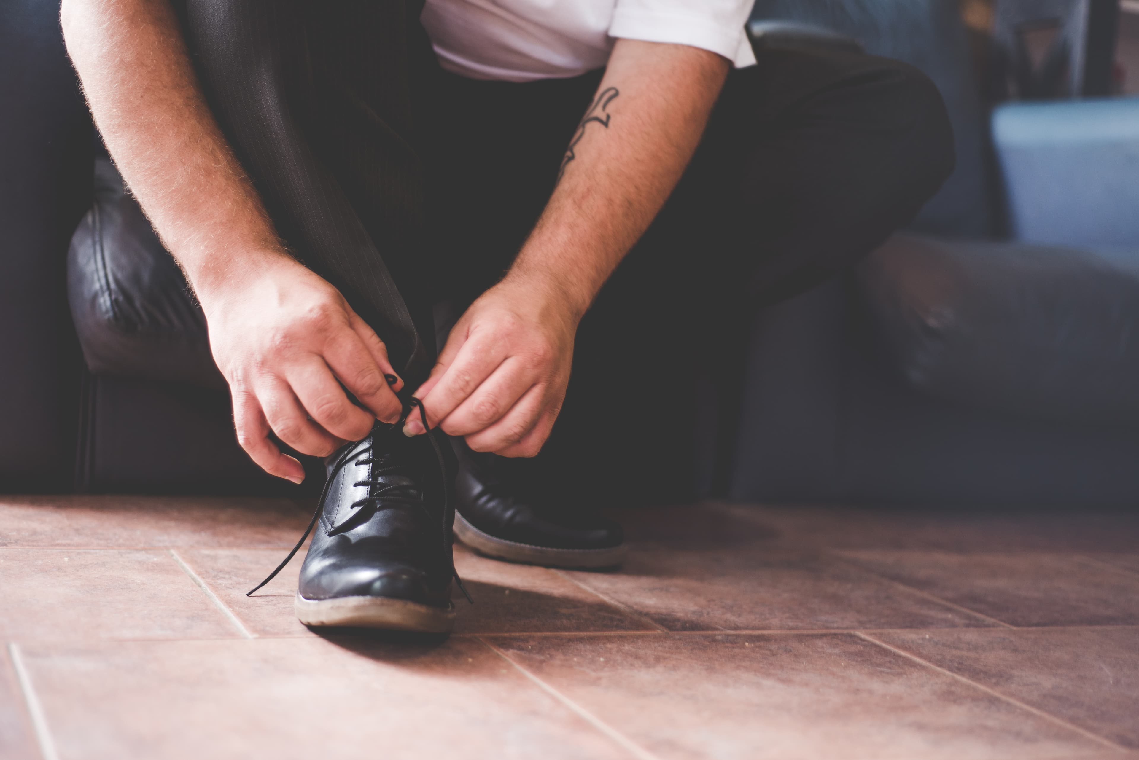 Bride and groom walking through a vineyard at dusk in golden Istrian light