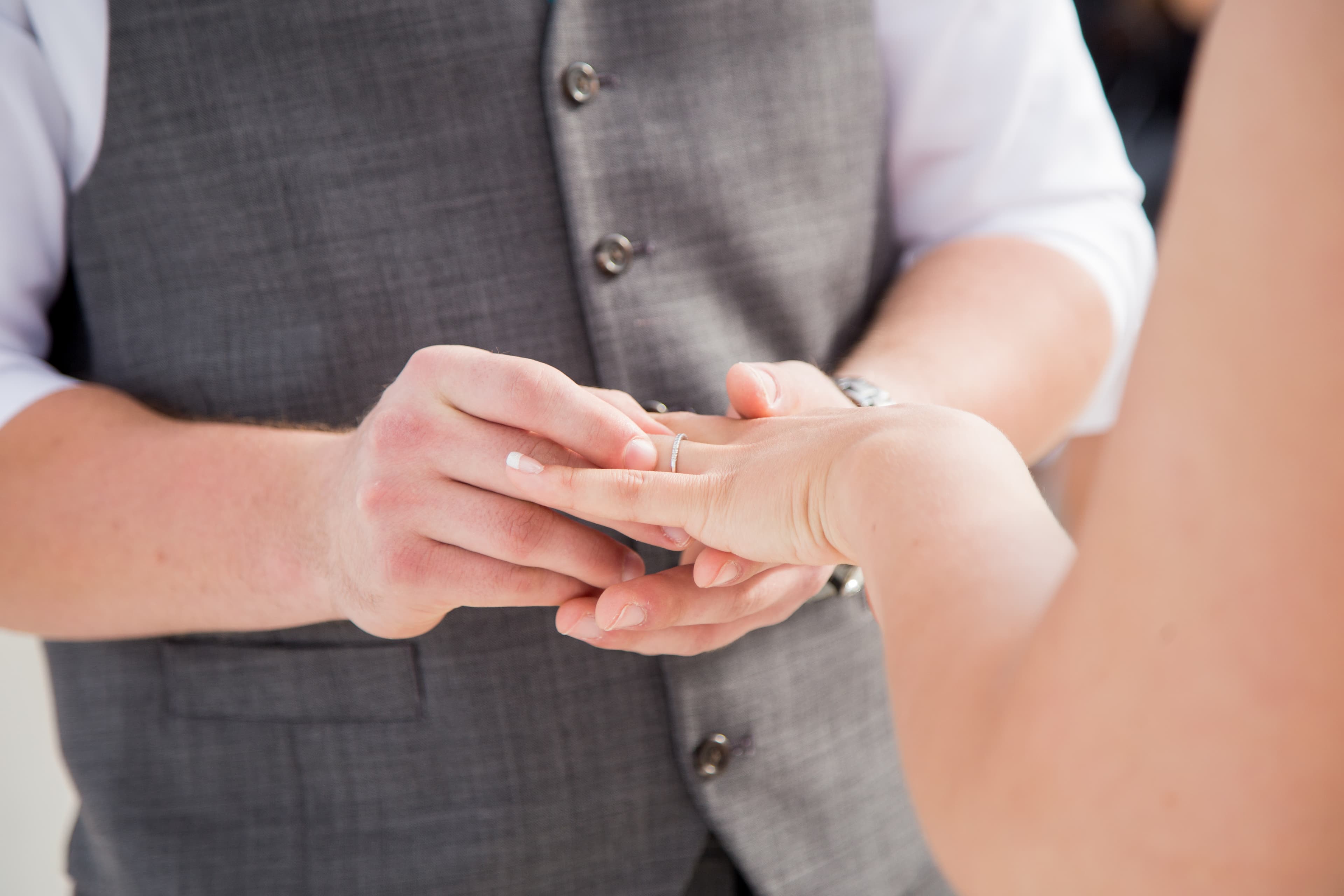 Bride and groom walking through a vineyard at dusk in golden Istrian light