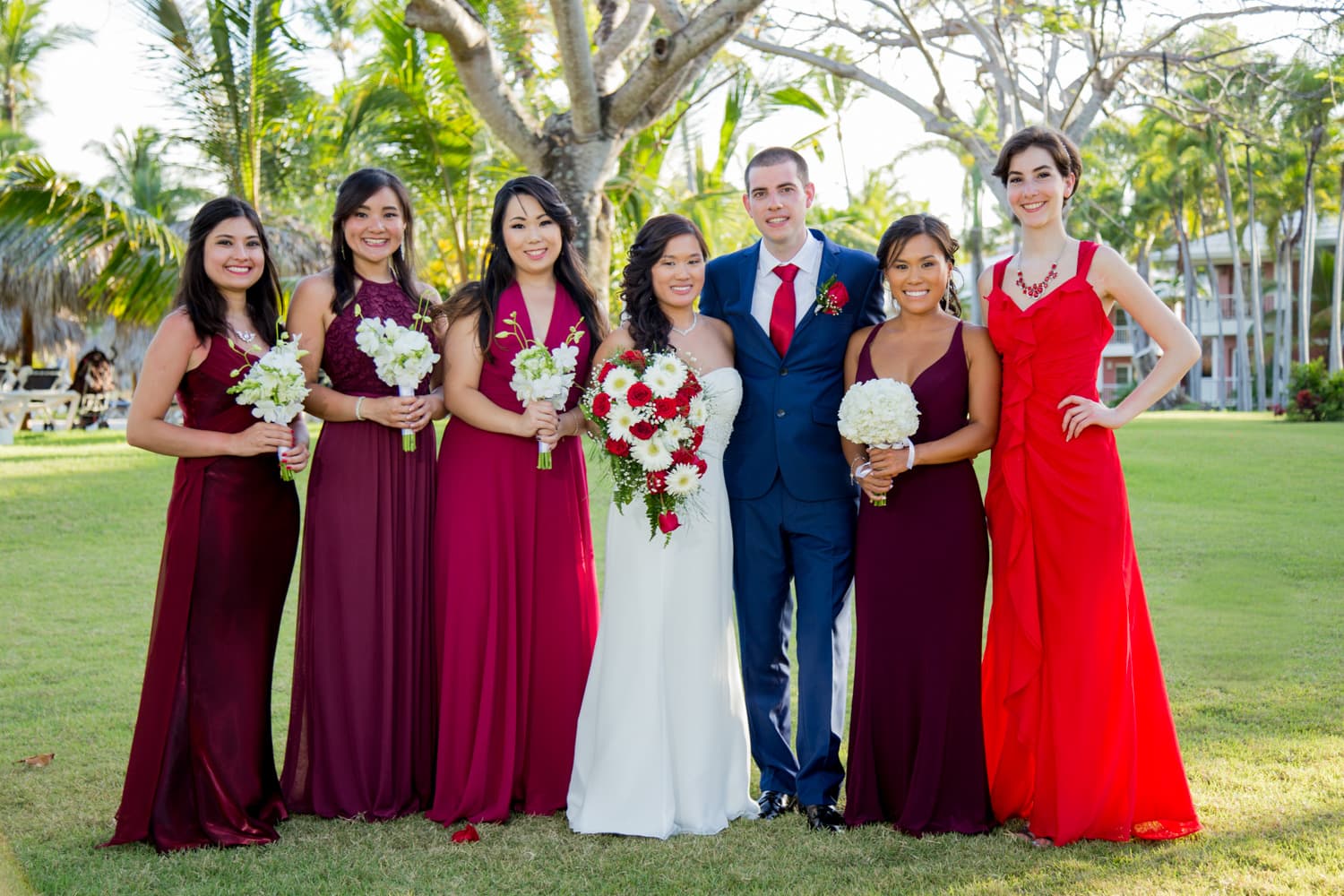 Bride and groom walking through a vineyard at dusk in golden Istrian light